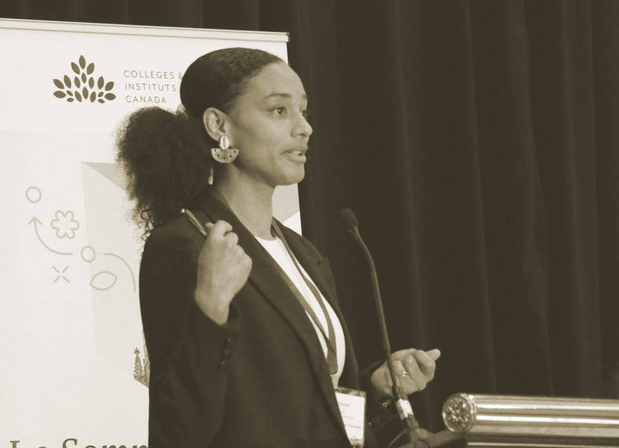 A leaders summit speaker talks on stage